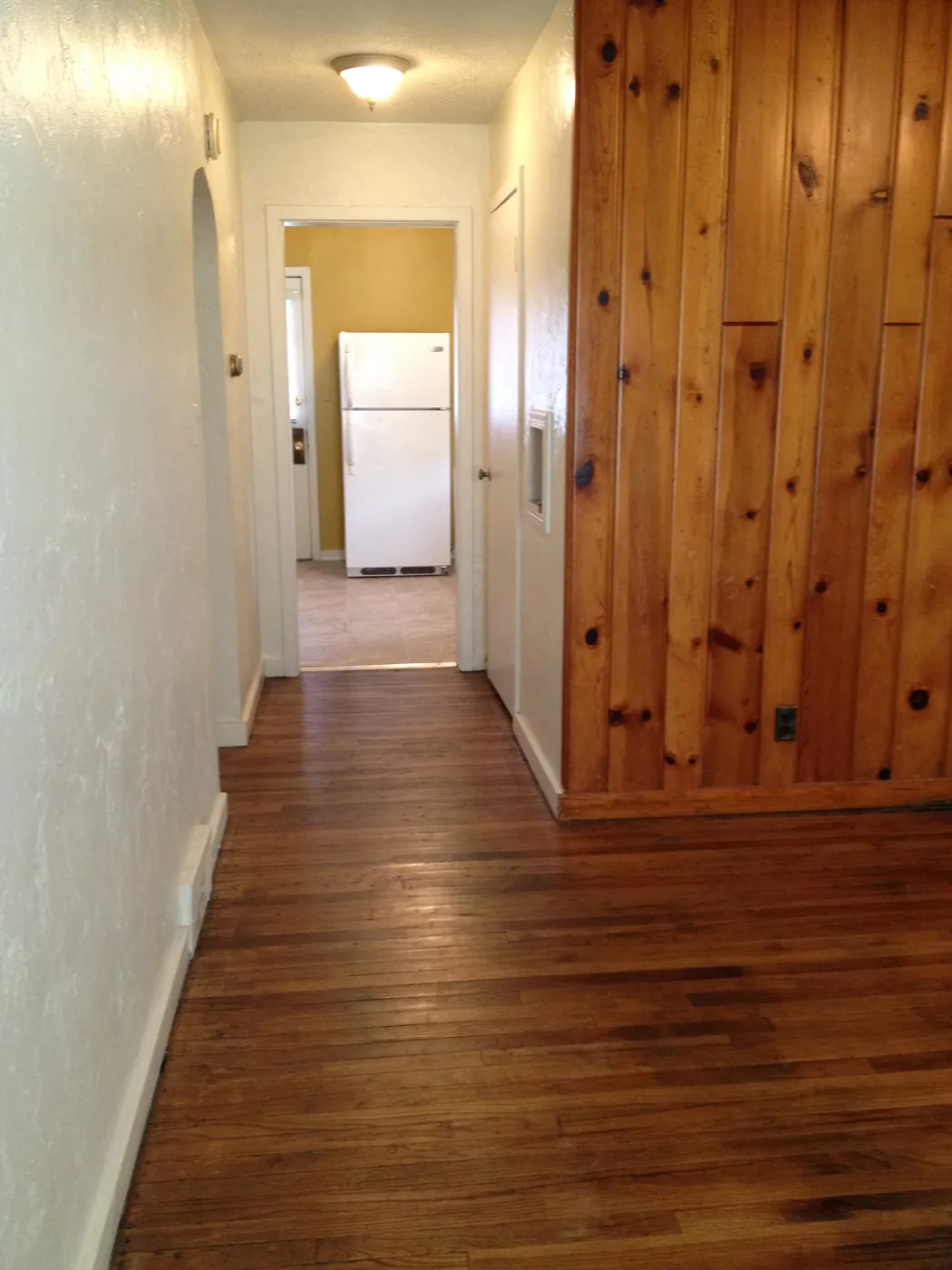 Hallway with hardwood floors