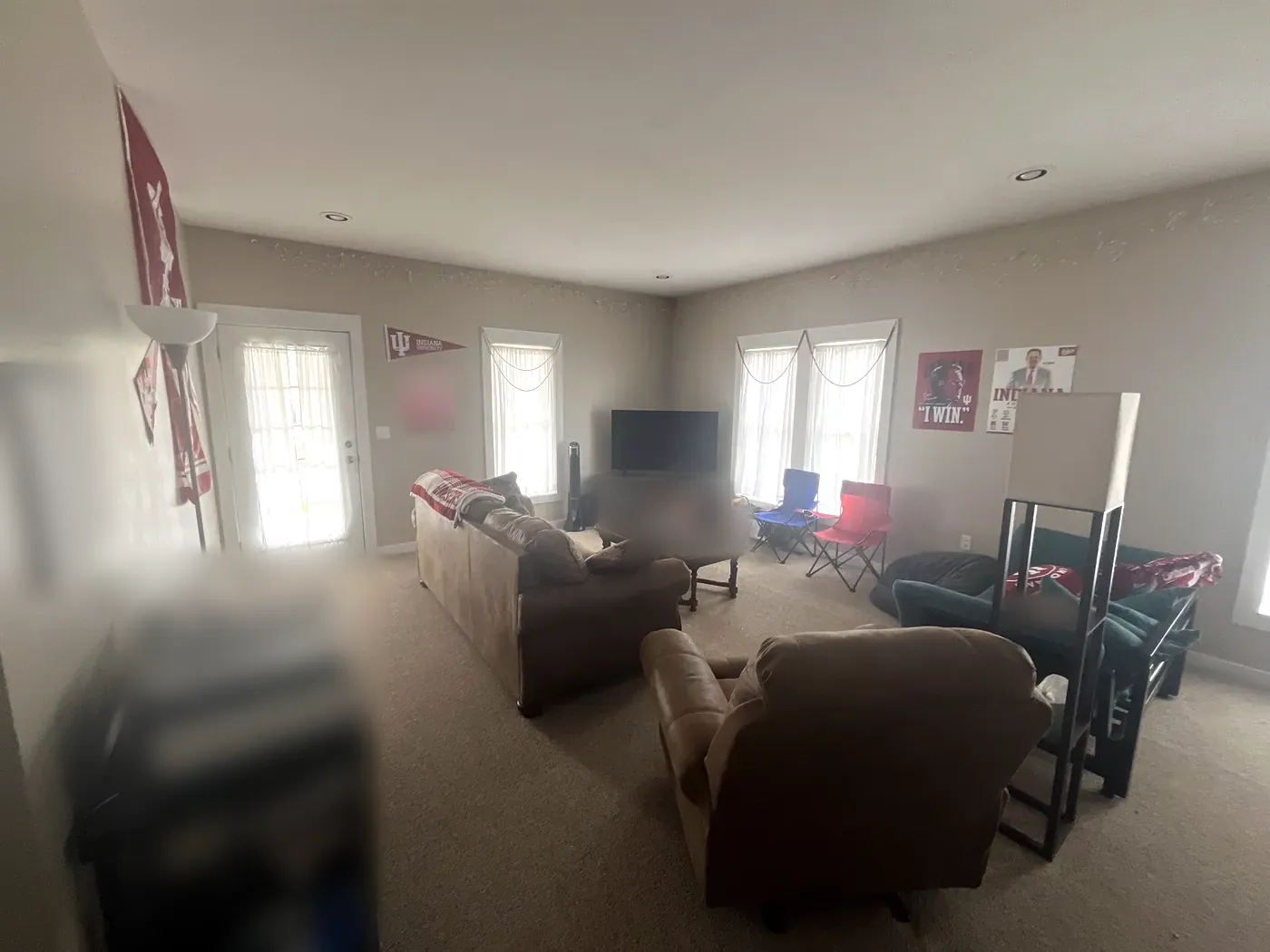 Furnished living room with french door and plenty of windows