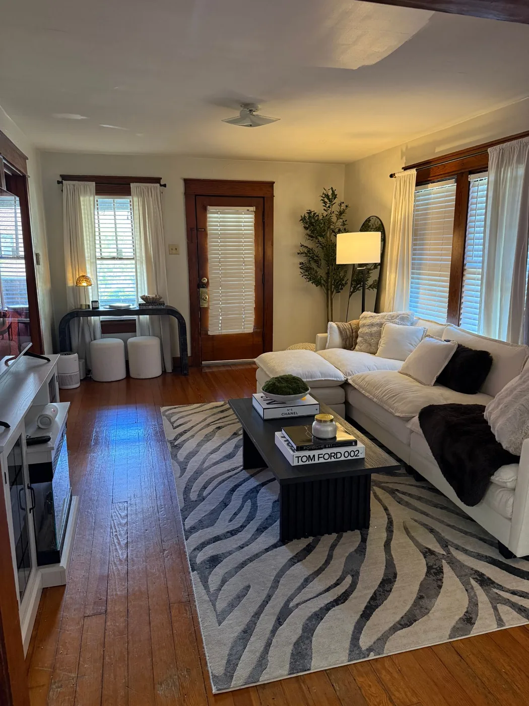 Living room with hardwood floors and front door